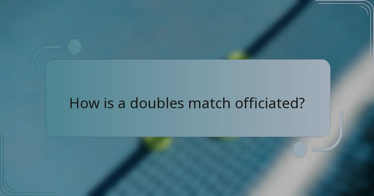 How is a doubles match officiated?